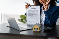 Seaside Park real estate agent holding up a contract on a clipboard