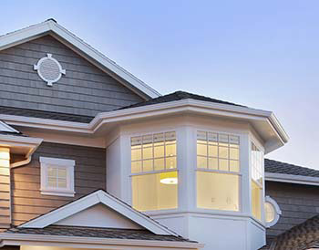 Vinyl exterior in greige and white home built by Ocean County custom home builder