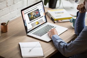 SEO Ocean County helps users find your website; man using laptop browing to NJ Contractor Corner website