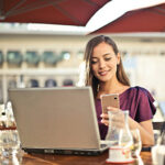 Woman using mobile banking app provided by NJ NCR dealers