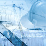 Blue-tone picture of custom home builders in Ocean County tools and plans including a ruler, hard hat, and blueprints