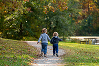 2 children running/walking on a trail in a park nearby to homes for sale in Middletown NJ